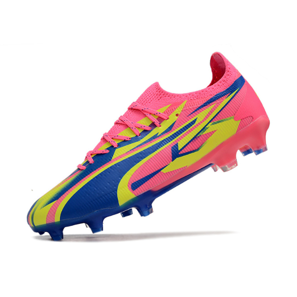 Botas de fútbol Puma Ultra Ultimate rosa y amarillo para terreno firme FG