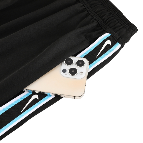 Conjunto de entrenamiento Nike azul y negro: camiseta y pantalones cortos