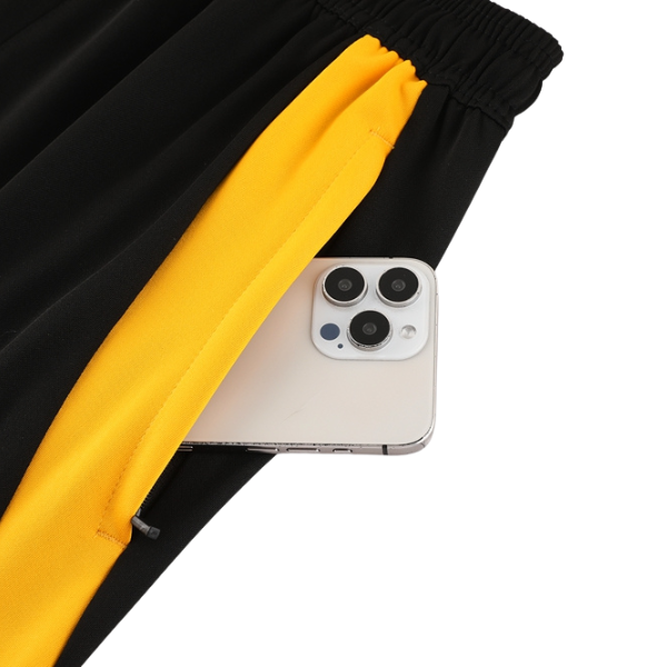 Camiseta y pantalones Adidas Cold Set azul, amarillo y negro con cremallera de un cuarto