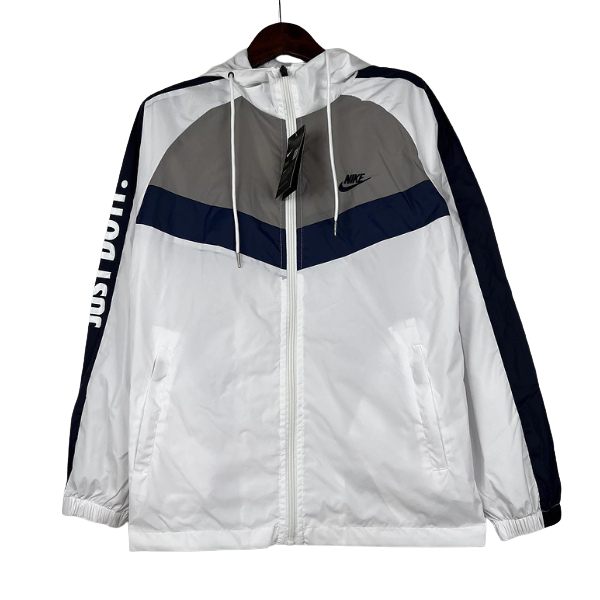 Chaqueta cortavientos Nike blanca, gris y azul 