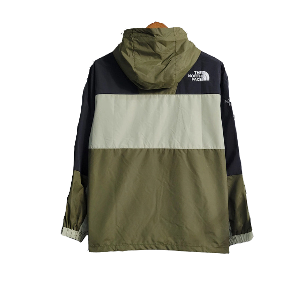 Chaqueta cortavientos verde y beige de The North Face