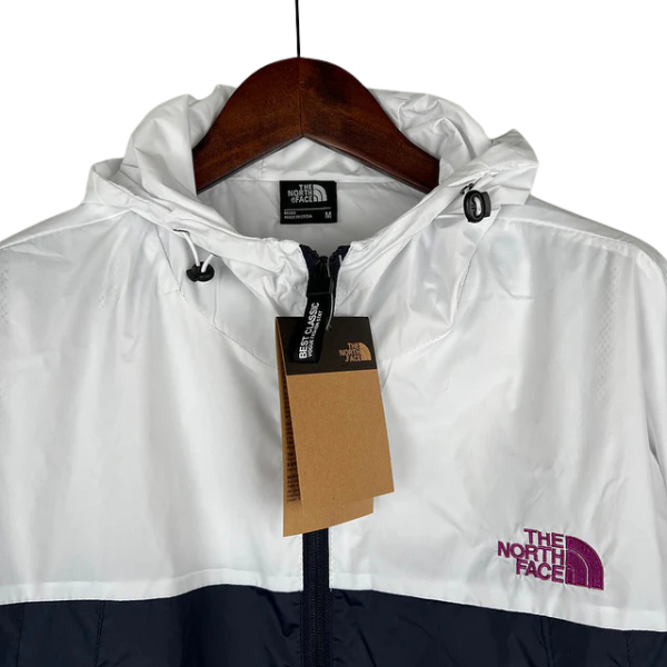 Chaqueta cortavientos The North Face blanca, rosa y azul